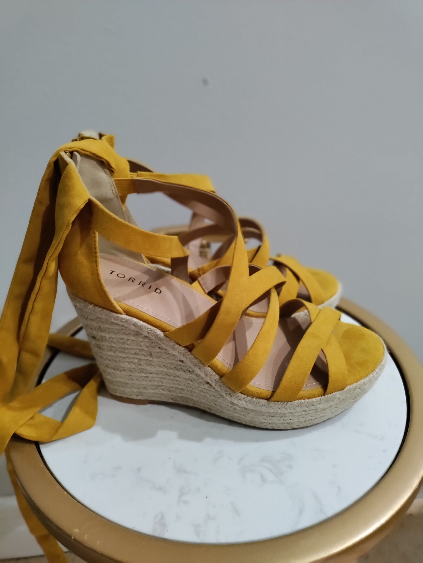 Torrid wedge string up heels
