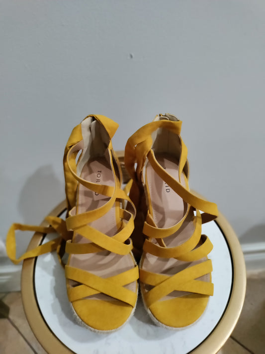 Torrid wedge string up heels